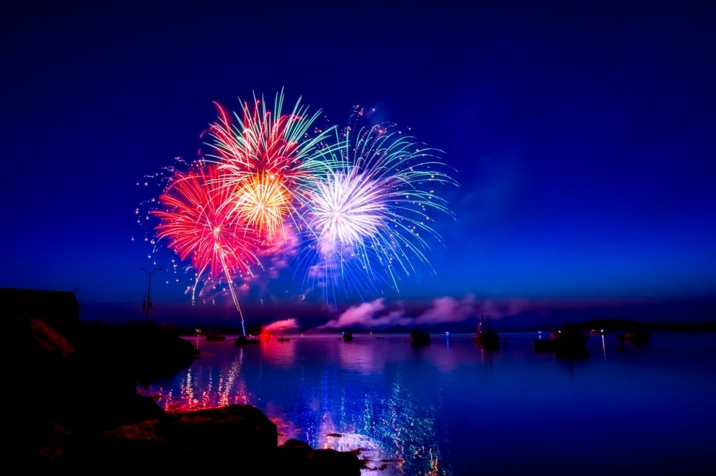 4th of July fireworks over water at night